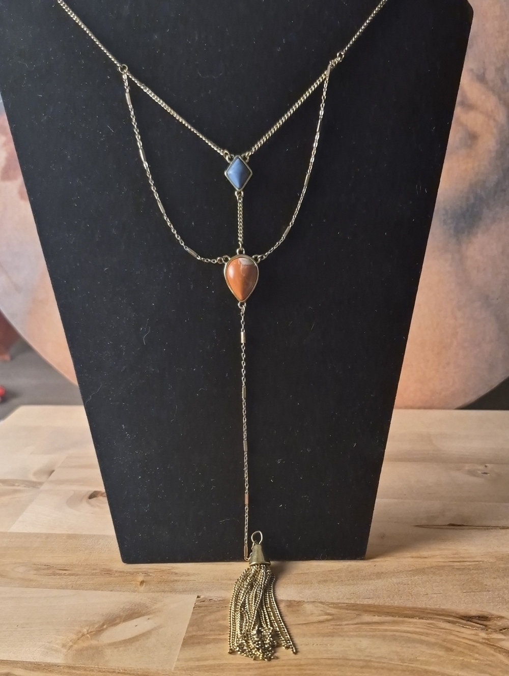 Gold-Tone Layered Necklace with Orange Teardrop and Blue Accent